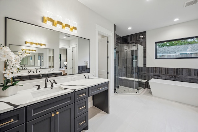 full bath featuring a shower stall, a freestanding tub, visible vents, tile patterned floors, and vanity