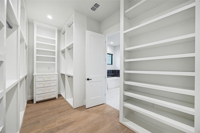 walk in closet with visible vents and light wood-style flooring