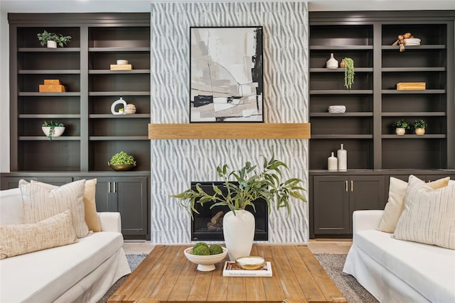 living area with built in features and wood finished floors