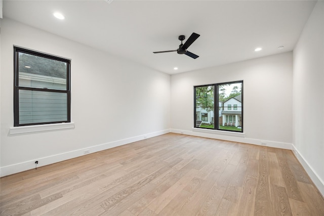 unfurnished room with light wood finished floors, recessed lighting, ceiling fan, and baseboards