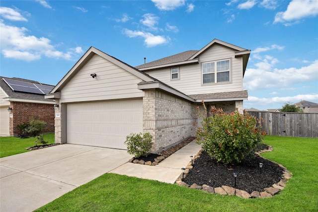 traditional-style home featuring fence, a front yard, brick siding, concrete driveway, and an attached garage