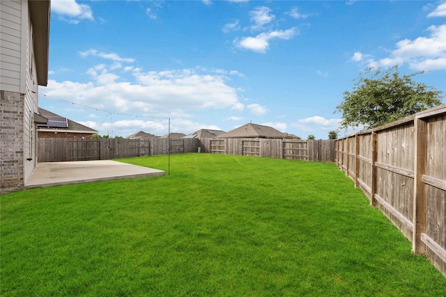 view of yard with a fenced backyard and a patio area