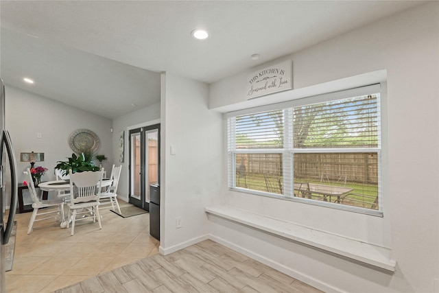 dining area featuring baseboards, recessed lighting, and lofted ceiling
