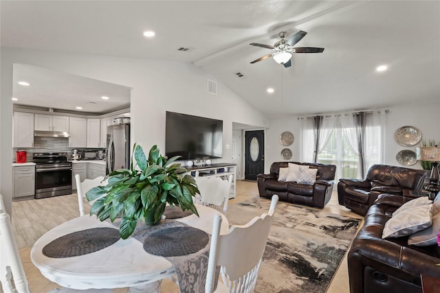 living room featuring visible vents, ceiling fan, and beamed ceiling