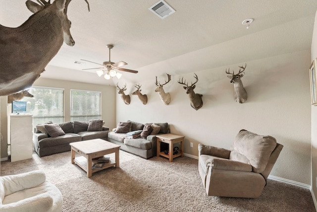 21735 Lozar Dr, Spring, TX 77379 - carpeted living area featuring a ceiling fan, baseboards, visible vents, and vaulted ceiling