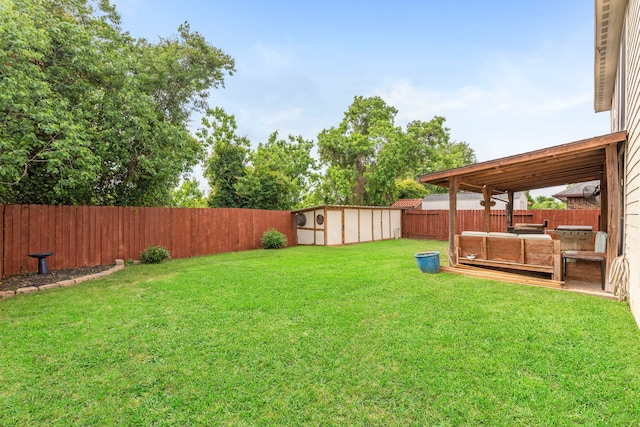 21735 Lozar Dr, Spring, TX 77379 - view of yard with a fenced backyard, a storage unit, and an outdoor structure