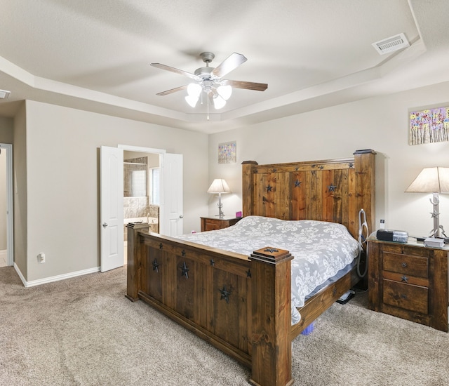 21735 Lozar Dr, Spring, TX 77379 - bedroom with a ceiling fan, visible vents, light colored carpet, a raised ceiling, and baseboards