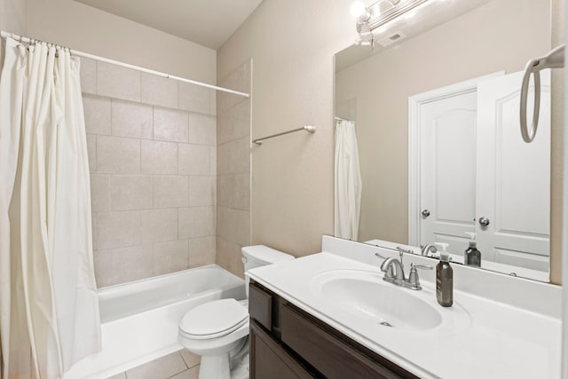 21735 Lozar Dr, Spring, TX 77379 - bathroom featuring vanity, tile patterned flooring, shower / bath combo, and toilet