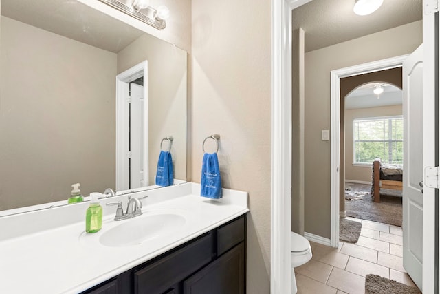 21735 Lozar Dr, Spring, TX 77379 - bathroom featuring vanity, tile patterned flooring, baseboards, and toilet