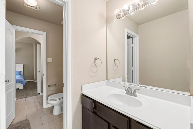 21735 Lozar Dr, Spring, TX 77379 - bathroom featuring tile patterned floors, vanity, toilet, and visible vents