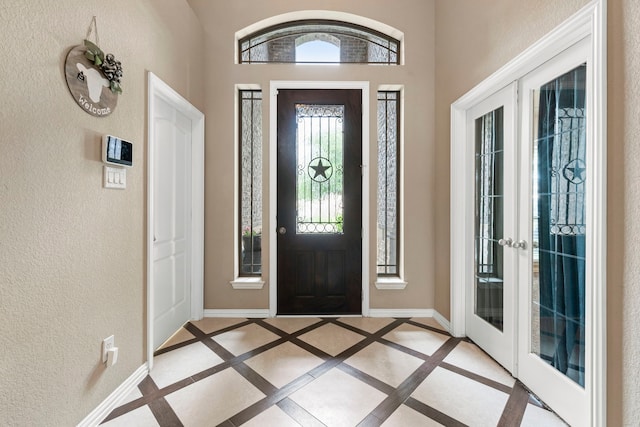 21735 Lozar Dr, Spring, TX 77379 - entryway featuring baseboards, a textured wall, and french doors