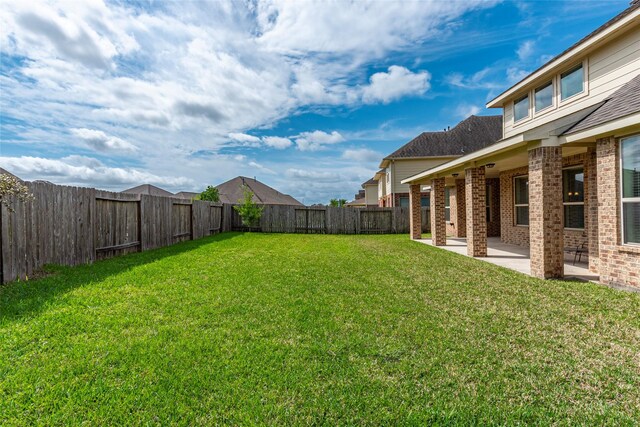 2623 Holbrook Springs Ln, League City, TX 77573 - view of yard featuring a fenced backyard and a patio area