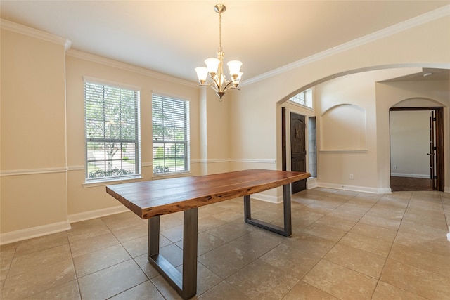 2623 Holbrook Springs Ln, League City, TX 77573 - unfurnished dining area featuring a chandelier, baseboards, arched walkways, and ornamental molding