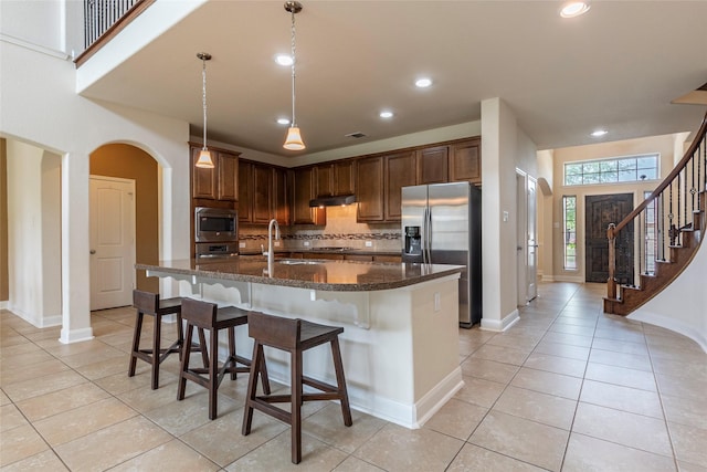 2623 Holbrook Springs Ln, League City, TX 77573 - kitchen featuring light tile patterned floors, backsplash, a sink, and appliances with stainless steel finishes