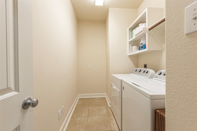 2623 Holbrook Springs Ln, League City, TX 77573 - laundry room with light tile patterned floors, washer and dryer, laundry area, and baseboards