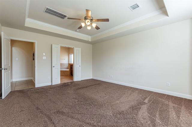 2623 Holbrook Springs Ln, League City, TX 77573 - unfurnished bedroom featuring visible vents, a raised ceiling, crown molding, and carpet flooring