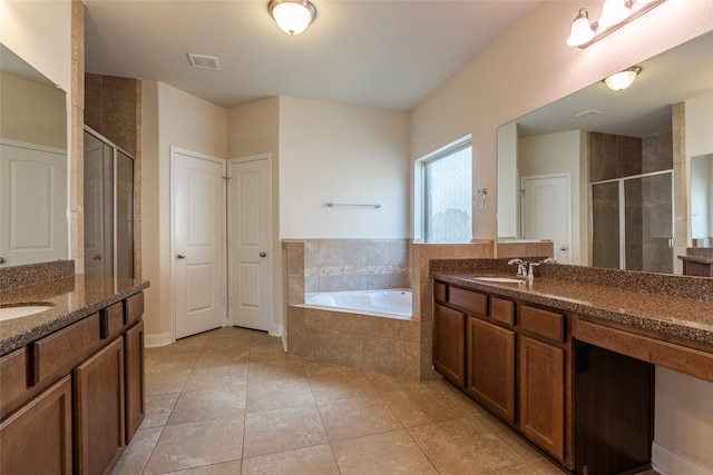 2623 Holbrook Springs Ln, League City, TX 77573 - bathroom with a bath, tile patterned flooring, a shower stall, and two vanities