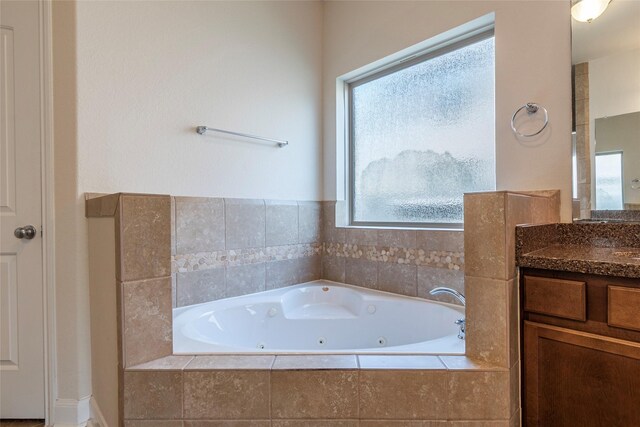 2623 Holbrook Springs Ln, League City, TX 77573 - bathroom featuring a tub with jets and vanity