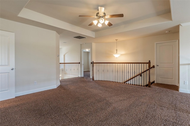 2623 Holbrook Springs Ln, League City, TX 77573 - empty room with carpet floors, baseboards, visible vents, a raised ceiling, and a ceiling fan