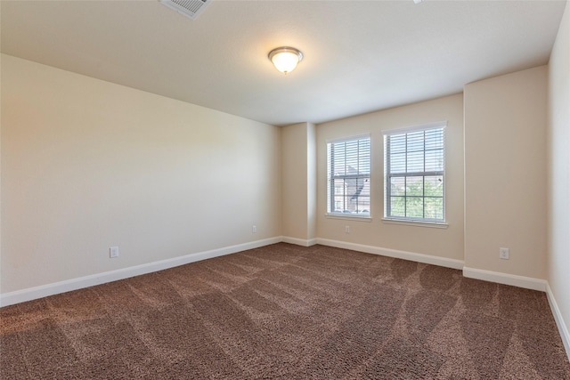 2623 Holbrook Springs Ln, League City, TX 77573 - empty room featuring dark carpet, visible vents, and baseboards