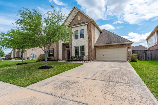 2623 Holbrook Springs Ln, League City, TX 77573 - traditional home featuring a garage, fence, and a front yard