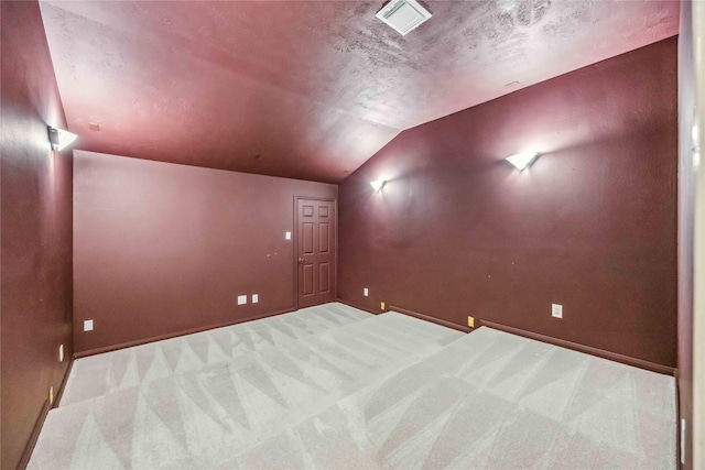 home theater with lofted ceiling, carpet, and baseboards