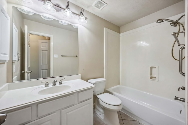 bathroom with toilet, tile patterned floors, vanity, and shower / tub combination