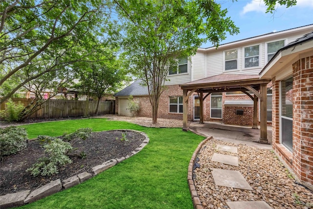 view of yard featuring a gazebo, a patio area, and a garage