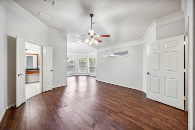 unfurnished living room with crown molding, a ceiling fan, dark wood-style flooring, and baseboards
