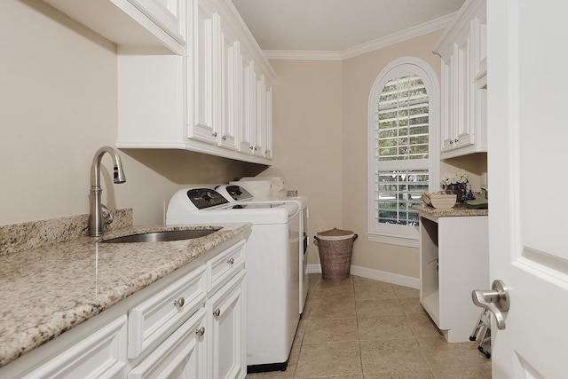 8 Autumn Cres, The Woodlands, TX 77381 - clothes washing area with a sink, cabinet space, washer and clothes dryer, baseboards, and ornamental molding