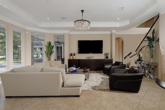 8 Autumn Cres, The Woodlands, TX 77381 - living room featuring a chandelier, visible vents, ornamental molding, and a tray ceiling