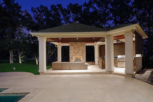8 Autumn Cres, The Woodlands, TX 77381 - view of patio / terrace with a gazebo, an outdoor living space with a fireplace, exterior kitchen, and an outdoor pool