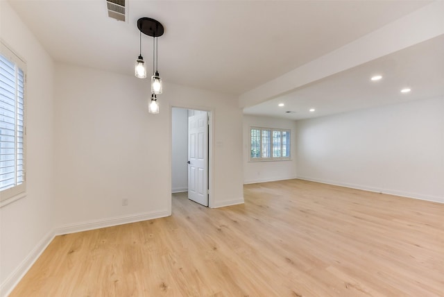 spare room with visible vents, recessed lighting, light wood-style flooring, and baseboards