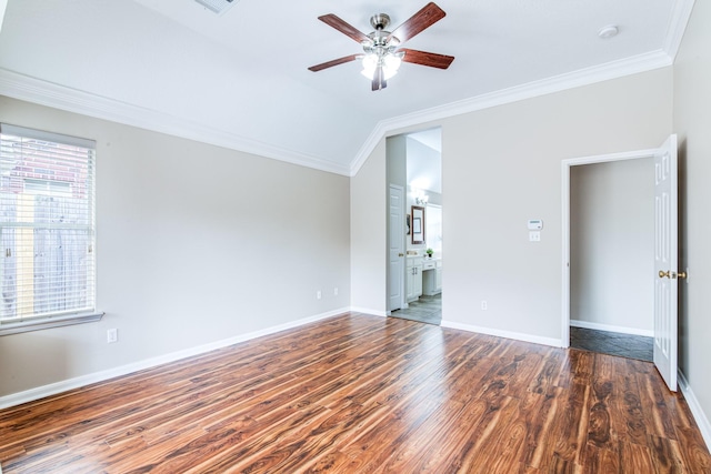 interior space with crown molding, ceiling fan, wood finished floors, and baseboards