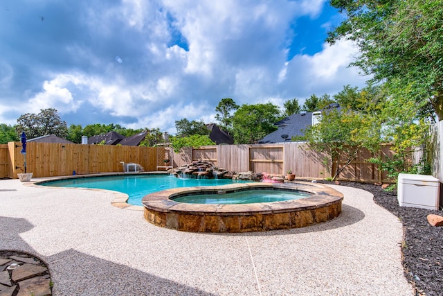 view of swimming pool featuring a fenced in pool, a patio, an in ground hot tub, and a fenced backyard