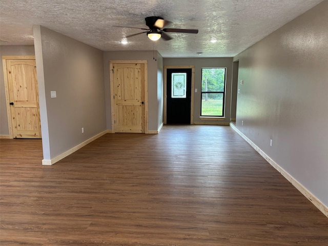 entryway with baseboards and dark wood-style floors
