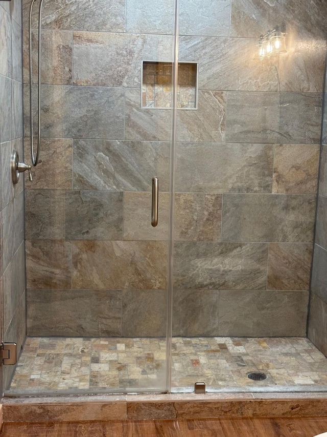 bathroom with a shower stall
