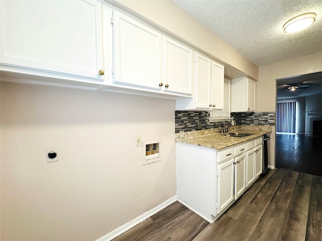 12550 Whittington Dr Unit 1015, Houston, TX 77077 - clothes washing area with a sink, laundry area, hookup for a washing machine, a textured ceiling, and dark wood finished floors