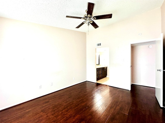 12550 Whittington Dr Unit 1015, Houston, TX 77077 - spare room featuring a ceiling fan, visible vents, dark wood-style flooring, and baseboards