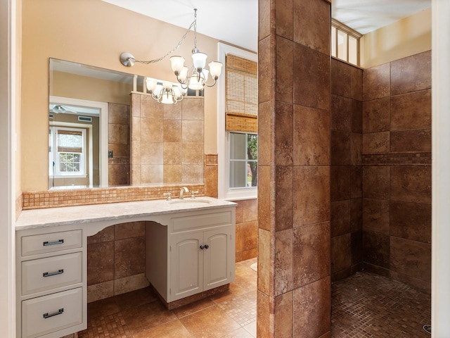 full bathroom featuring a chandelier, tasteful backsplash, tile walls, and vanity