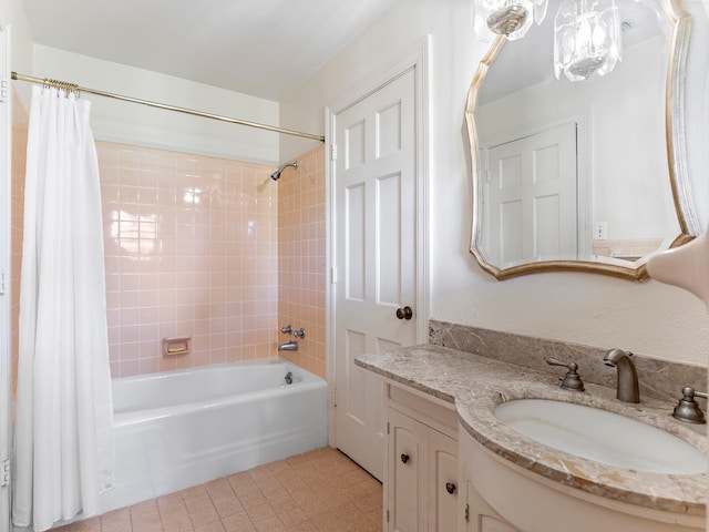 bathroom featuring shower / bathtub combination with curtain, tile patterned flooring, and vanity