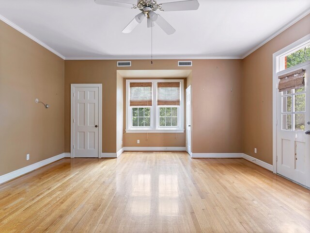 interior space featuring baseboards, visible vents, and a wealth of natural light