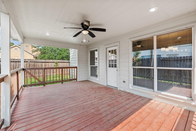 wooden deck featuring fence and a ceiling fan