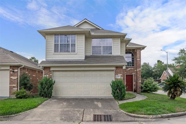 view of front of house featuring driveway, a garage, and brick siding