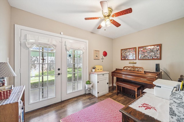 sitting room featuring french doors, ceiling fan, and dark wood-style floors