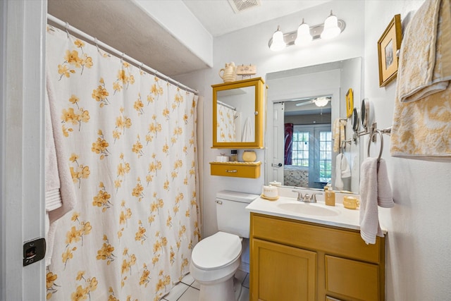 bathroom with visible vents, a shower with shower curtain, toilet, tile patterned floors, and vanity