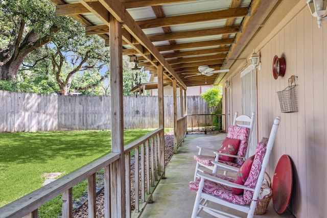 view of patio / terrace with fence and a ceiling fan