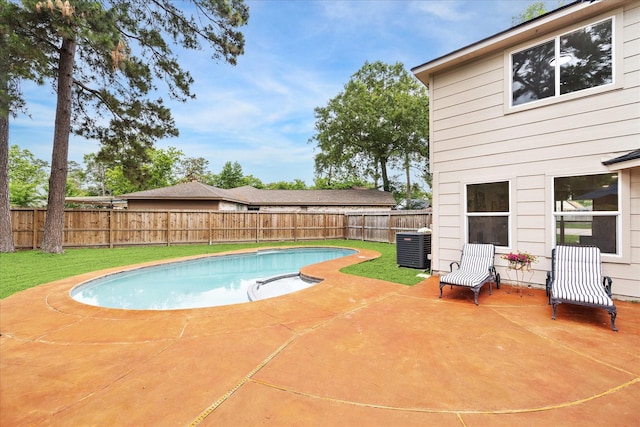 view of pool with a fenced backyard, a fenced in pool, central AC unit, a lawn, and a patio