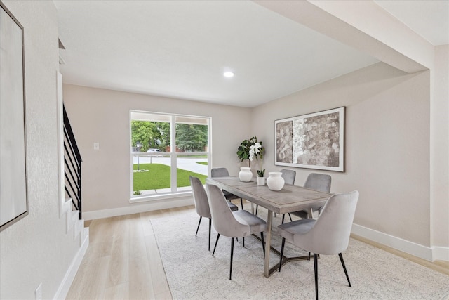 dining area with baseboards, recessed lighting, and light wood finished floors