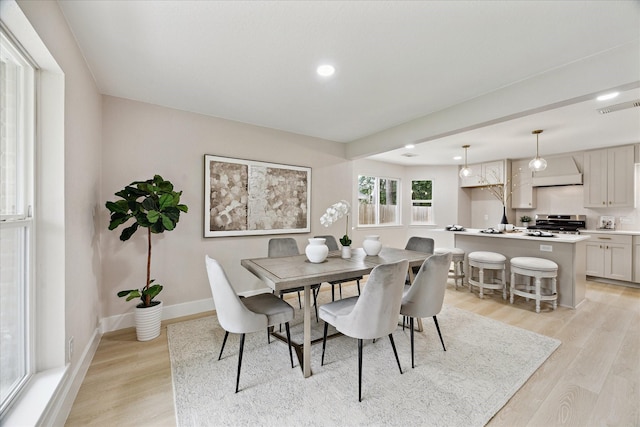 7811 Ashwell Ct, Spring, TX 77389 - dining area featuring light wood-style floors, baseboards, and recessed lighting